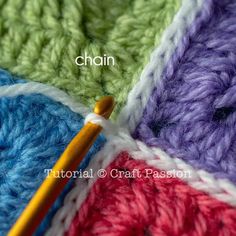 the crochet stitch is being worked on by a knitting needle and yarn ball