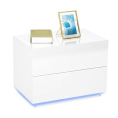 a white counter with a gold frame on top and a blue light under the edge