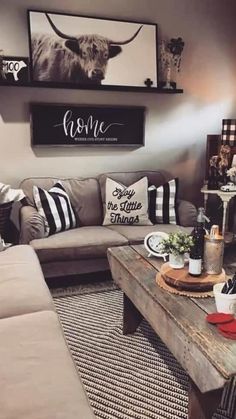 a living room filled with lots of furniture and decor on top of a wooden table