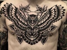 a man with an owl tattoo on his chest