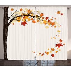 the curtains are decorated with autumn leaves