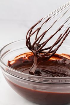 chocolate sauce in a bowl with a whisk