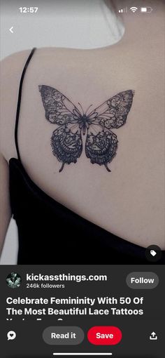 the back of a woman's shoulder with a butterfly tattoo on it