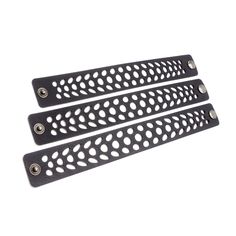 two black metal handles with holes on them