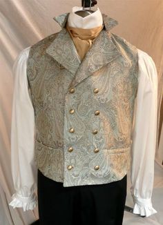 Our very popular English Regency Double Breasted Waistcoat buttons high on the chest, perfect for showcasing a crisp linen shirt and beautiful silk cravat. A special feature of my vests is that the back is made of the same fancy fabric as the front, not just a lining fabric. You choice of buttons:  matte gold, antiqued gold or made of self fabric to match. Plus one extra - just in case! 2 functioning hip pockets, and an adjustable back belt that creates a custom fit for you This is a custom made Fitted Gold Vest Elegant Style, Fitted Gold Elegant Vest, Gold Fitted Vest, Elegant Gold Fitted Vest, Fitted Wedding Vest With Buttons, Fitted Vest With Buttons For Wedding, Elegant Wedding Vest With Buttons, Sleeveless Vest With Buttons For Wedding, Elegant Formal Vest With Buttons