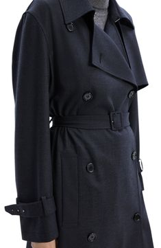 Be undercover chic in this longline trench designed in a double-breasted silhouette with a slender defining belt. Double-breasted button closure Notched lapels Belted cuffs Removable belt Front slant pockets Unlined 40% wool, 29% polyester, 28% viscose, 3% spandex Dry clean Imported Fitted Double-breasted Outerwear With Belted Cuffs, Elegant Fitted Pea Coat With Belted Cuffs, Elegant Double-breasted Pea Coat With Belted Cuffs, Elegant Pea Coat With Belted Cuffs For Work, Fitted Pea Coat With Belted Cuffs For Work, Chic Business Outerwear With Belt Detail, Chic Double-breasted Outerwear With Self Belt, Business Pea Coat With Belted Cuffs And Lapel Collar, Classic Tailored Outerwear With Belted Cuffs