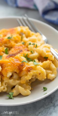 a white plate topped with macaroni and cheese