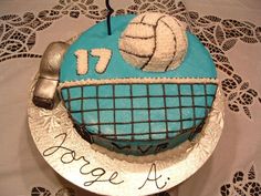 there is a cake that has been made to look like a volleyball net and ball