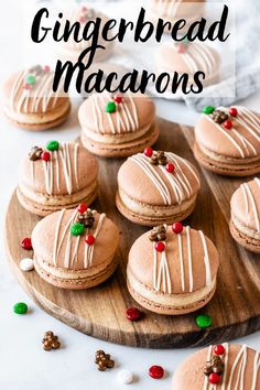 gingerbread macarons with white icing on a wooden platter