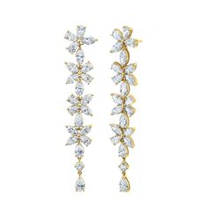 Add a touch of elegance to your wardrobe with our exquisite Long Floral Diamond Earrings, crafted in 18k white gold. The stylish drop design features a stunning floral motif, adorned with dazzling diamonds that effortlessly catch the light with every move. Luxury Wedding Diamond Earrings With Sparkling Stones, Luxury Diamond Earrings For Wedding With Sparkling Stones, Luxury Drop Diamond Earrings With Elegant Design, Timeless Evening Bridal Earrings With Cubic Zirconia, Glamorous White Gold Bridal Earrings For Formal Occasions, Luxury Bridal Drop Earrings With Sparkling Stones, Elegant Diamond Earrings For Wedding, Elegant Diamond Cluster Earrings For Formal Occasions, Hand Set Diamond White Earrings For Evening