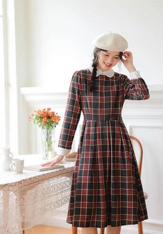 Vintage inspired full plaid dress with contrasting collar and cuffs. Concealed back zipper with waist ties. S: 33.5" chest, 28" waist, 43" lengthM: 35" chest, 29.5" waist, 43" lengthL: 36.5" chest, 31" waist, 43.5" lengthXL: 38" chest, 32.5" waist, 43.5" length Fitted Plaid Preppy Dress For Fall, Fitted Plaid Dress For Fall, Preppy Style, Fitted Plaid Dress For Fall In Preppy Style, Preppy Plaid Dress For Fall, Retro Plaid Winter Dresses, Plaid Midi Length Dress For Work, Workwear Midi Length Plaid Dress, Preppy Long Sleeve Dresses For Fall, Midi-length Plaid Dress For Fall