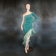 will fit size 5/6-11/12, very stretchy This dazzling Aqua Latin-rhythm dress is crafted from luxurious Aqua solid slinky, with fetching ruching up the left side and flounces of Aqua glittered organza, plus a second set of flounces in a stunning glitter swirly lace. The bodice is adorned with exquisite Aqua AB Swarovski rhinestones, Further, Swarovski hand beading in teal, Aqua, and CAB in various sizes & shapes, plus an arm embellishment with flounces complete this elegant look - the perfect cho Fitted Mermaid Dress With Rhinestones For Evening, Fitted Green Dresses With Rhinestones, Fitted Dresses With Rhinestones For Dance, Fitted Rhinestone Dress For Dance, Green Fitted Ballroom Dress, Fitted Green Ballroom Dress, Green Fitted Dress For Ballroom, Rhythm Dress, Latin Dress