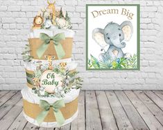 a baby shower cake with an elephant on top