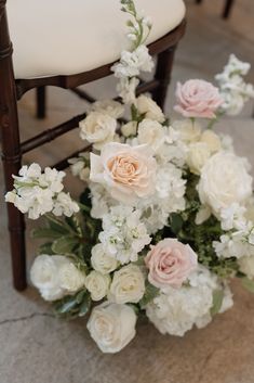 a bouquet of flowers sitting on top of a chair