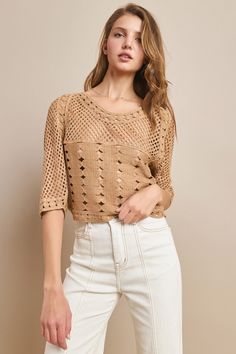 This Short Sleeve Cropped Knit Top is the perfect addition to your wardrobe for nights out and concerts. The western style adds a unique touch, while the oversized and cropped fit allows for versatility in dressing it up or down. Stay on-trend and comfortable with this must-have top. Chic Beige Cropped Sweater For Spring, Knit Crop Top For Day Out In Fall, Cropped Beige Sweater For Spring, Trendy Cream Cropped Sweater For Spring, Cream Knit Cropped Sweater For Spring, Spring Cream Knit Cropped Sweater, Chic Knit Crop Top For Fall, Chic Textured Knit Long Sleeve Crop Top, Spring Cropped Cream Sweater