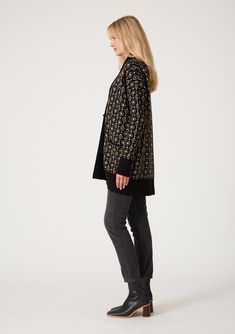 An ultra-warm mid-length cardigan in a black and taupe geo jacquard design. Geo jacquard Relaxed fit Long sleeve Drop shoulder Mid-length Shawl collar Toggle button closure Side pockets Contrast ribbed trim Bohemian cardigan An effortless slouchy cardigan designed in a cool geo jacquard pattern. Featuring a warm shawl collar, essential side pockets, and long sleeves with a relaxed dropped shoulder. The toggle closure secures at the front. Model is 5'9, wearing a size S/M. Style: I-50249K-SMG Elegant Black Jacquard Knit Sweater, Black Jacquard Knit Cardigan For Fall, Fall Jacquard Knit Cardigan For Layering, Black Jacquard Knit Casual Outerwear, Black Jacquard Knit Outerwear For Fall, Casual Black Jacquard Knit Outerwear, Elegant Jacquard Knit Cardigan For Work, Black Casual Cardigan With Fair Isle Pattern, Casual Black Cardigan With Fair Isle Pattern