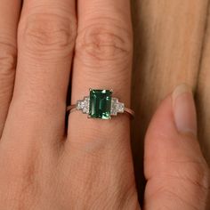 It is a lab green sapphire ring. The main stone is 6 mm*8 mm emerald cut.weight about 1.70 carats. The basic metal is sterling silver and plated with rhodium/14k white gold/14k rose gold/14k yellow gold You can also go to my shop Home for more elegant rings: https://www.etsy.com/shop/godjewelry?ref=hdr_shop_menu Customization is always welcome and please feel free to contact with me if you have any design ideas! Emerald Cut Sapphire Ring, Elegant Rings, Green Sapphire Ring, Silver Wedding Ring, Ring Emerald Cut, Sterling Silver Wedding Rings, Ring Emerald, Silver Wedding Rings, Green Sapphire