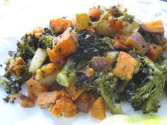 a white plate topped with broccoli and potatoes