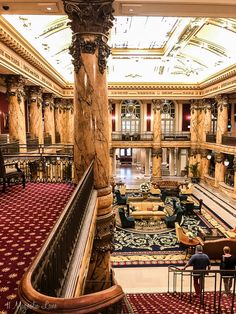 an ornately decorated lobby with couches and tables