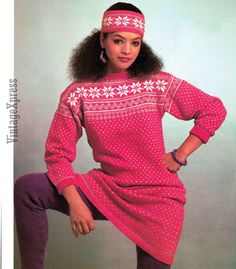 a woman in a pink sweater dress and headband poses for a magazine cover with her hands on her hips