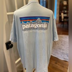 Brand New Never Worn Questions? Leave A Comment Below! Blue Relaxed Fit T-shirt For Outdoor Activities, Blue Graphic Tee For Outdoor Activities, Patagonia Relaxed Fit Tops For Outdoor Activities, Blue Cotton T-shirt For Outdoor Activities, Blue Cotton Tops For Outdoor Activities, Patagonia Crew Neck Tops For Outdoor Activities, Patagonia Graphic Tee Short Sleeve T-shirt, Casual Patagonia Tops For Outdoor Activities, Patagonia Outdoor Short Sleeve T-shirt