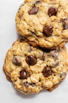 three chocolate chip cookies stacked on top of each other