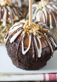 chocolate covered apples with white and brown toppings