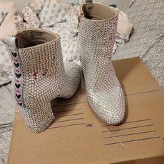 These Are A 1 Of A Kind, Handmade (Not By Me) Taylor Swift Eras Tour Sparkly Boots. Size 7. These Boots Are Stunning. The Right Shoe Has Ts In Pink, The Left Has Ts In Black. The Back Of The Boots Have Black Hearts Lined In Smaller Silver Stones With Pink Stone Spacers. These Have Been Worn 1 Time For Maybe 10 Minutes. I Got A Ton Of Compliments On These Boots. Now It's Time For Them To Go To Another Swiftie. Any Questions, Please Ask. Bedazzled Boots, Me Taylor Swift, Sparkly Boots, Taylor Swift Eras Tour, Black Hearts, Taylor Swift Eras, Pink Stone, Black Heart, Eras Tour