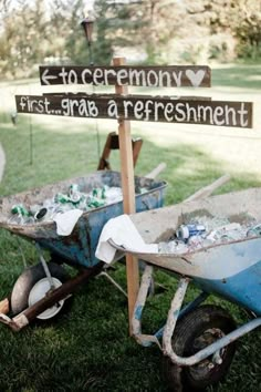 an old wheelbarrow is full of trash and signs that say it's ok to ceremony first, grab a refreshment