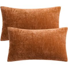 two brown velvet pillows sitting on top of each other