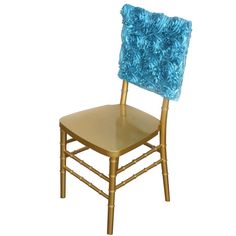 a gold chair with a blue pillow on it's back and the seat cushion is up