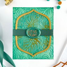 a green and gold greeting card with the word happy new year written in arabic on it