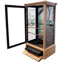 a large bird cage sitting inside of a wooden box