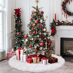 a decorated christmas tree in a living room with presents on the floor next to it