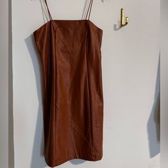 Perfect Condition Fits Like A Glove Brown Lined Mini Dress For Date Night, Chic Brown Mini Dress With Spaghetti Straps, Chic Brown Lined Mini Dress, Brown Leather Dress For Night Out, Brown Lined Mini Dress, Brown Leather Mini Dress For Night Out, Brown Fitted Faux Leather Dress, Brown Fitted V-neck Bodycon Dress, Non-stretch Solid Brown Dress