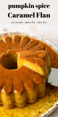 a pumpkin spice caramel flan on a plate with a knife stuck in it