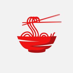 a red bowl filled with noodles and chopsticks