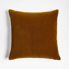 a brown pillow sitting on top of a white wall