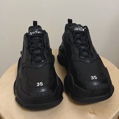 Authentic Balenciaga Triple S Sneaker In Black (Faux Leather) Brand New, Never Used! Size Eu 35/Us 5 (Narrow 6 Or 5.5 At Best) Comes With Original Box, Dust Bag, And Spare Laces. Still Up For Sale On Original Site! Feel Free To Make An Offer! Black Pointed Toe Synthetic Sneakers, Black Designer Synthetic Sneakers, Black Pointed Toe Sneakers With Branded Insole, Black Pointed Toe Sneakers With Rubber Sole, Balenciaga Triple S White, Balenciaga Race Runner, Balenciaga Track Sneaker, Balenciaga Sock, Balenciaga Track Sneakers