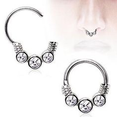 three different types of nose piercings with crystal stones on each end and an open nose ring