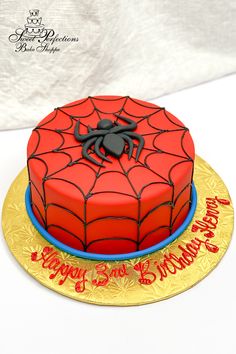 a spiderman birthday cake on a plate