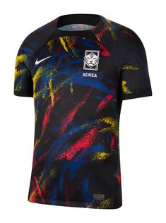 the nike soccer jersey is designed with colorful paint splattered on it and has a black