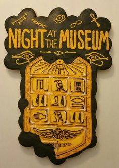 a yellow and black sign that says night at the museum