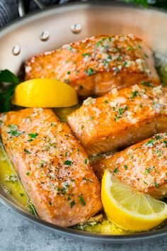 salmon with lemon and parsley in a pan