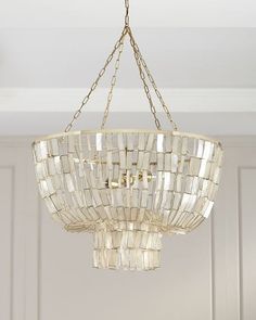 a chandelier hanging from a ceiling in a room