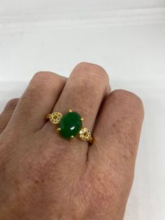 Vintage green nephrite jade Ornate German Silver ring, gold rhodium does not tarnish, NOT sterling Sizes 7, 8 or 9 All rings are shipped in a nice gift box. Check out our over a THOUSAND great reviews Engraving is $4 per letter and is not always perfect depending on the piece. It can take a few days if the jeweler is busy. This is payable to Paypal Judithsltd@gmail.com Classic Green Crystal Ring For Gift, Classic Green Oval Crystal Ring, Elegant Gold Jade Ring, Hallmarked Green Emerald Ring, Green Crystal Round Ring As Gift, Green Crystal Round Ring Gift, Green Crystal Round Ring For Gift, Green Jade Wedding Rings, Gold Emerald Oval Ring For Gift