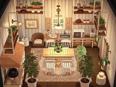 an aerial view of a living room and dining area with potted plants on the table