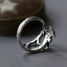 Take a daring approach to your style with our 925 Silver Star Bat Open Ring. Made with 925 silver, this ring features a unique bat design that adds a touch of adventure to any outfit. Embrace your bold side and stand out in the crowd with this eye-catching piece. Details Materials: 925 Sterling Silver Weight: 2.84G Size: Adjustable SKU: R24092610 Sun And Moon Rings, Bat Design, Moss Agate Ring, Flat Back Earrings, Gold Brooches, Feather Necklaces, Gold Bracelet Chain, Blue Zircon, Rose Gold Jewelry