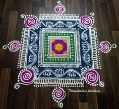 an intricate design on the floor with colorful colors