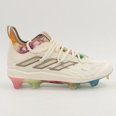 a pair of white shoes with multicolored paint splattered on the soles